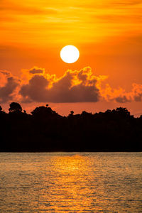 Scenic view of sea against orange sky