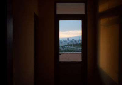 Silhouette of building seen through window