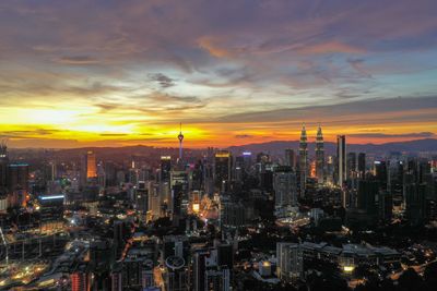 Aerial view of city during sunset