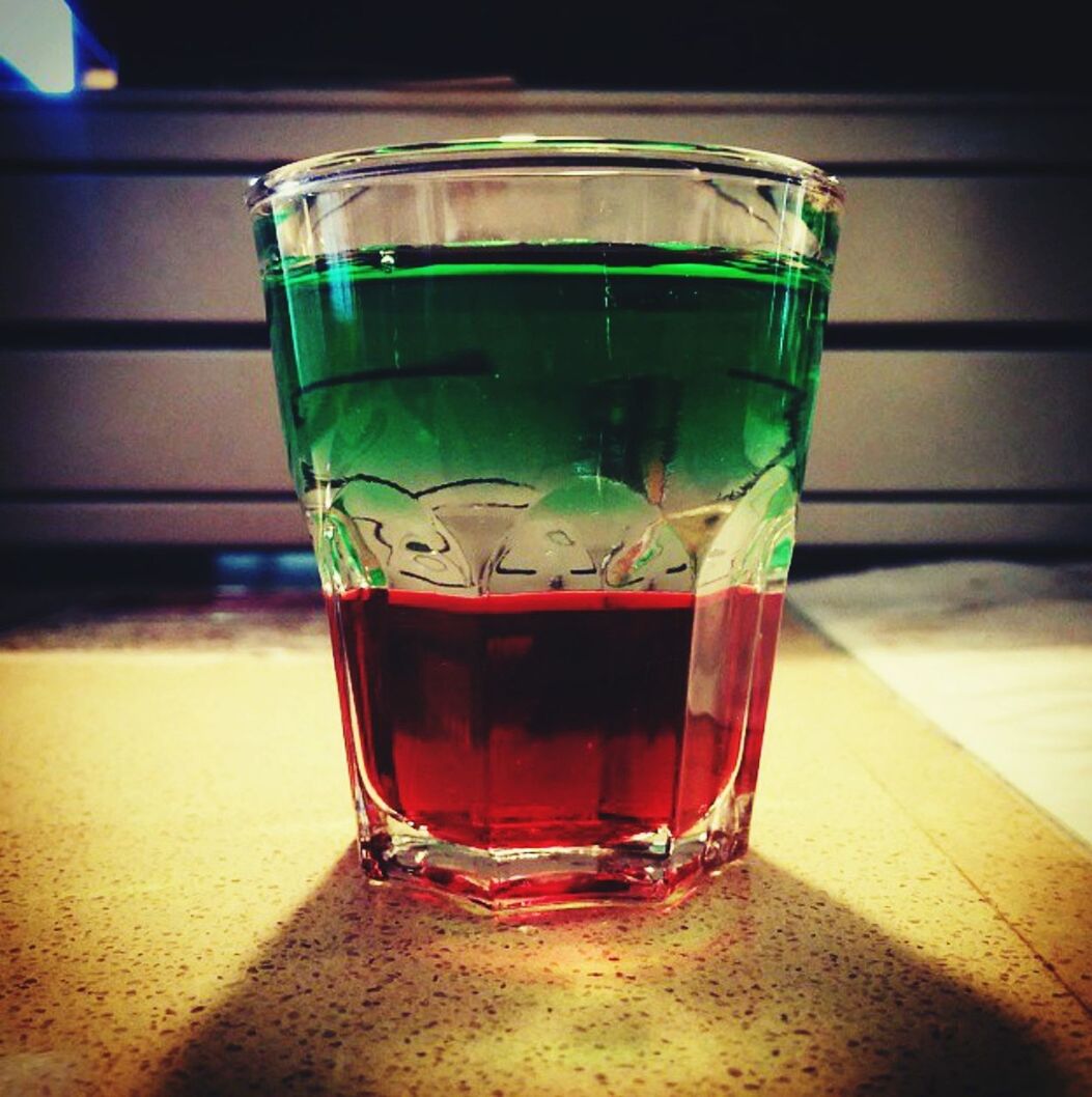 drinking glass, drink, food and drink, focus on foreground, close-up, indoors, green color, no people, table, half full, freshness, mint tea, day