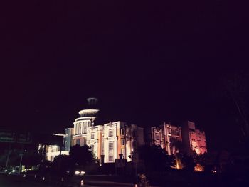 Low angle view of illuminated building at night