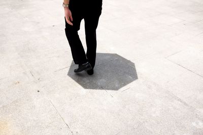 Low section of woman standing on floor