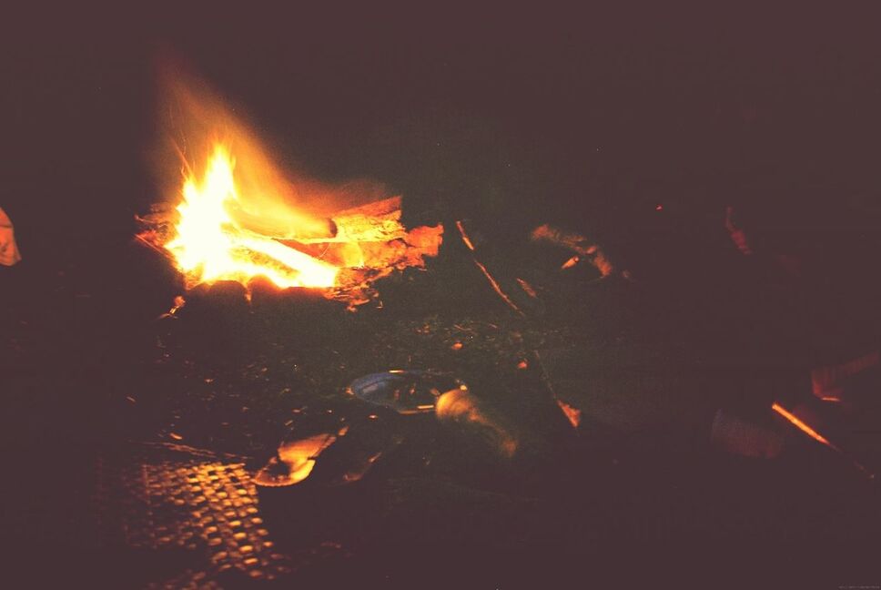 burning, flame, fire - natural phenomenon, night, heat - temperature, orange color, glowing, bonfire, fire, illuminated, dark, firewood, campfire, motion, high angle view, heat, light - natural phenomenon, outdoors, long exposure, no people