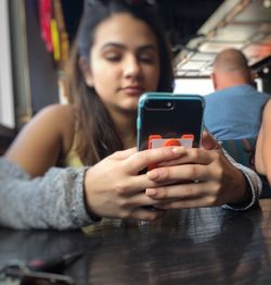 Young woman using mobile phone