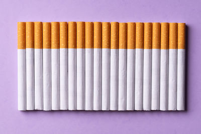 Directly above shot of colored pencils on white background