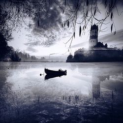 Scenic view of lake against cloudy sky