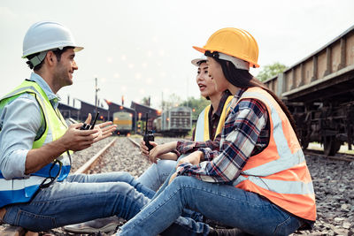 Side view of people working at construction site