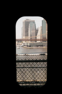 Buildings in city seen through window