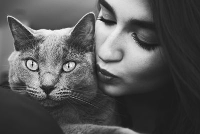 Close-up of beautiful woman with cat