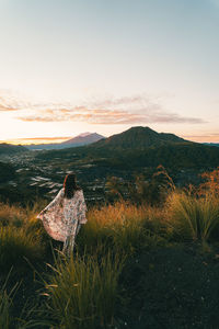 Scenic view of land against sky during sunset