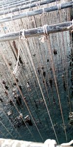 High angle view of rusty metal fence