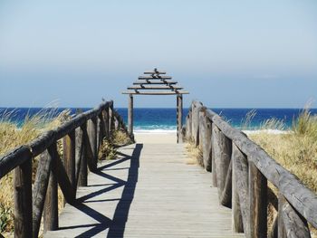 Pier over sea against sky