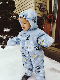 Cute boy standing in snow