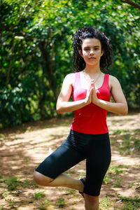 Teenage girl exercising at park