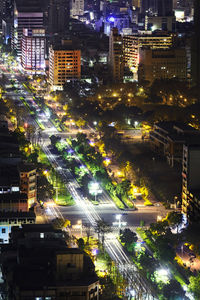 High angle view of illuminated buildings in city at night