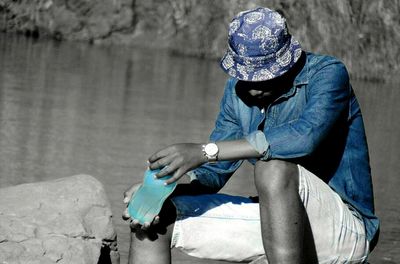 Close-up of a man sitting in water