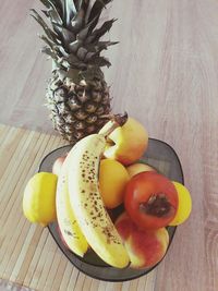 Close-up of fruits in plate on table