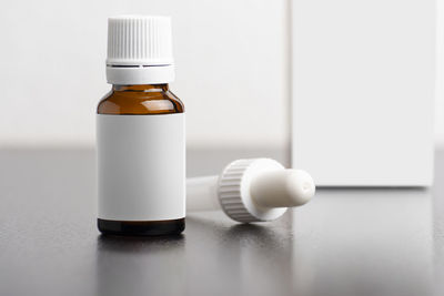 Close-up of empty bottle on table