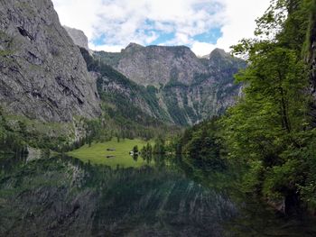 Scenic view of mountains and lake against sky