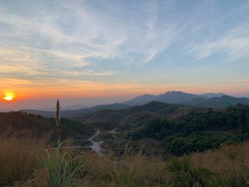 Scenic view of landscape against sky during sunset