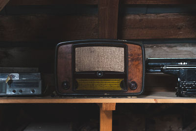 Close-up of old vintage television on table