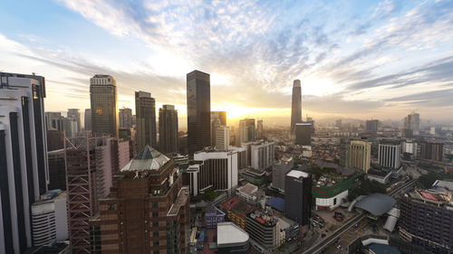 High angle view of modern buildings in city against sky