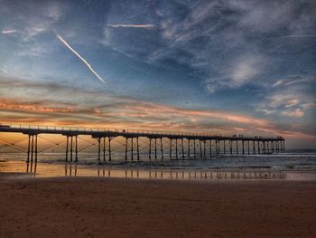 Scenic view of beach against sky during sunset