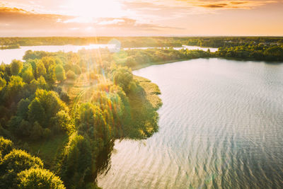 Scenic view of lake against sky during sunset