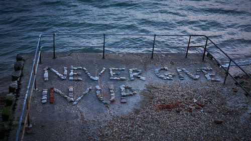 High angle view of text on beach