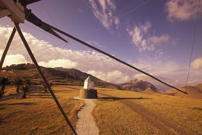 Traditional windmills against sky