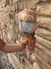 Child holding ice cream cone