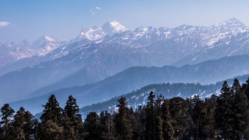 Scenic view of snowcapped mountains against clear sky