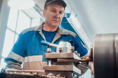 Portrait of man working at workshop