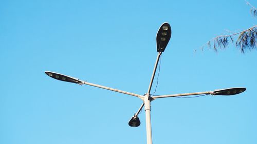 Low angle view of street light against sky