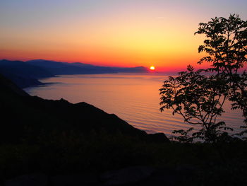 High angle view of calm beach at sunset