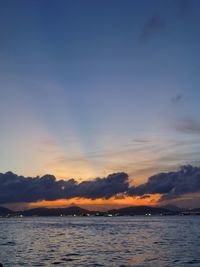 Scenic view of sea against sky at sunset