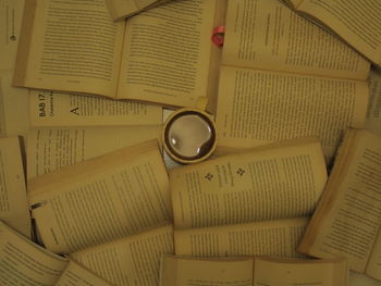 High angle view of wedding rings on book