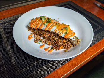 High angle view of fish in plate on table