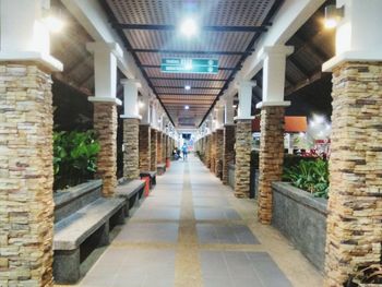 Empty corridor along buildings