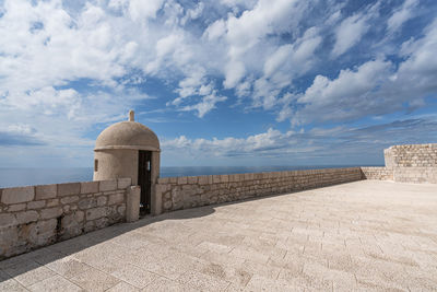 View of historical building against cloudy sky