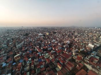 High angle view of townscape against sky during sunset