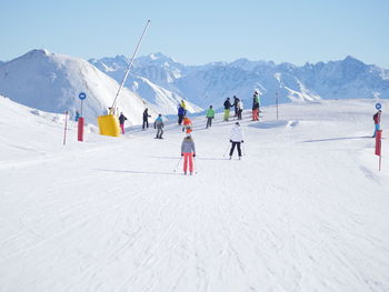 Tourists skiing at tourist resort