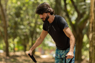 Man running and jogging at a park outdoors. male person workout. feel good, healthy concept. 