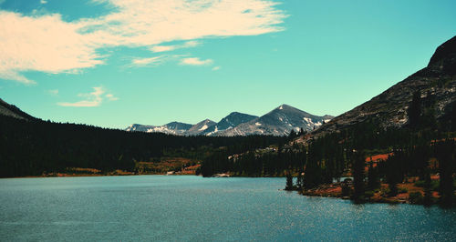 Scenic view of lake and mountains against sky