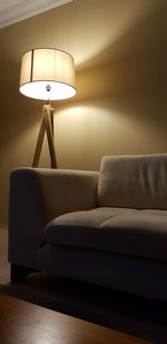 Electric lamp by sofa at home
