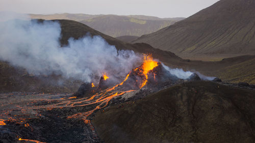 Smoke emitting from volcanic mountain at night