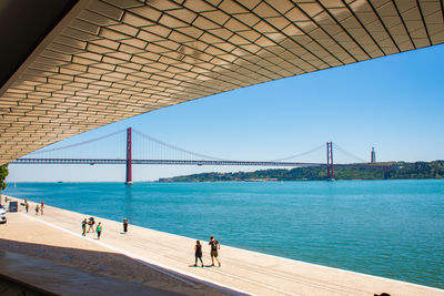 People walking on bridge