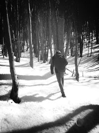 Woman standing on snow covered landscape