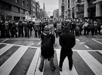 People standing on street in city