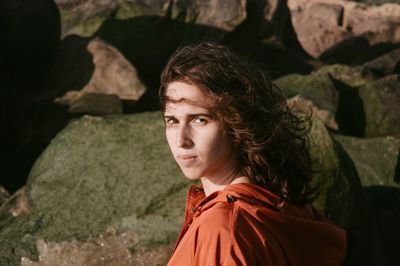 High angle portrait of young woman sitting outdoors